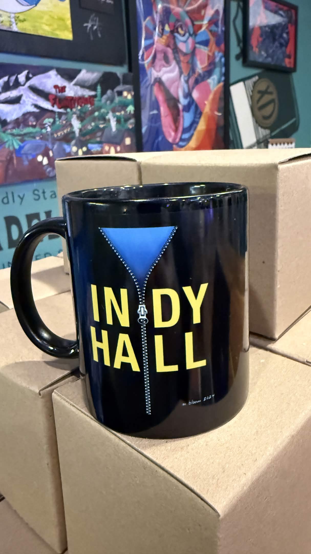 Indy Hall black glossy mug with zipper hoodie design